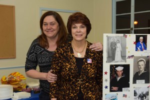 RW&B Dance organizer Sheila Lee R with Jenny Knisley on the L showing veterans photos SP8_0296