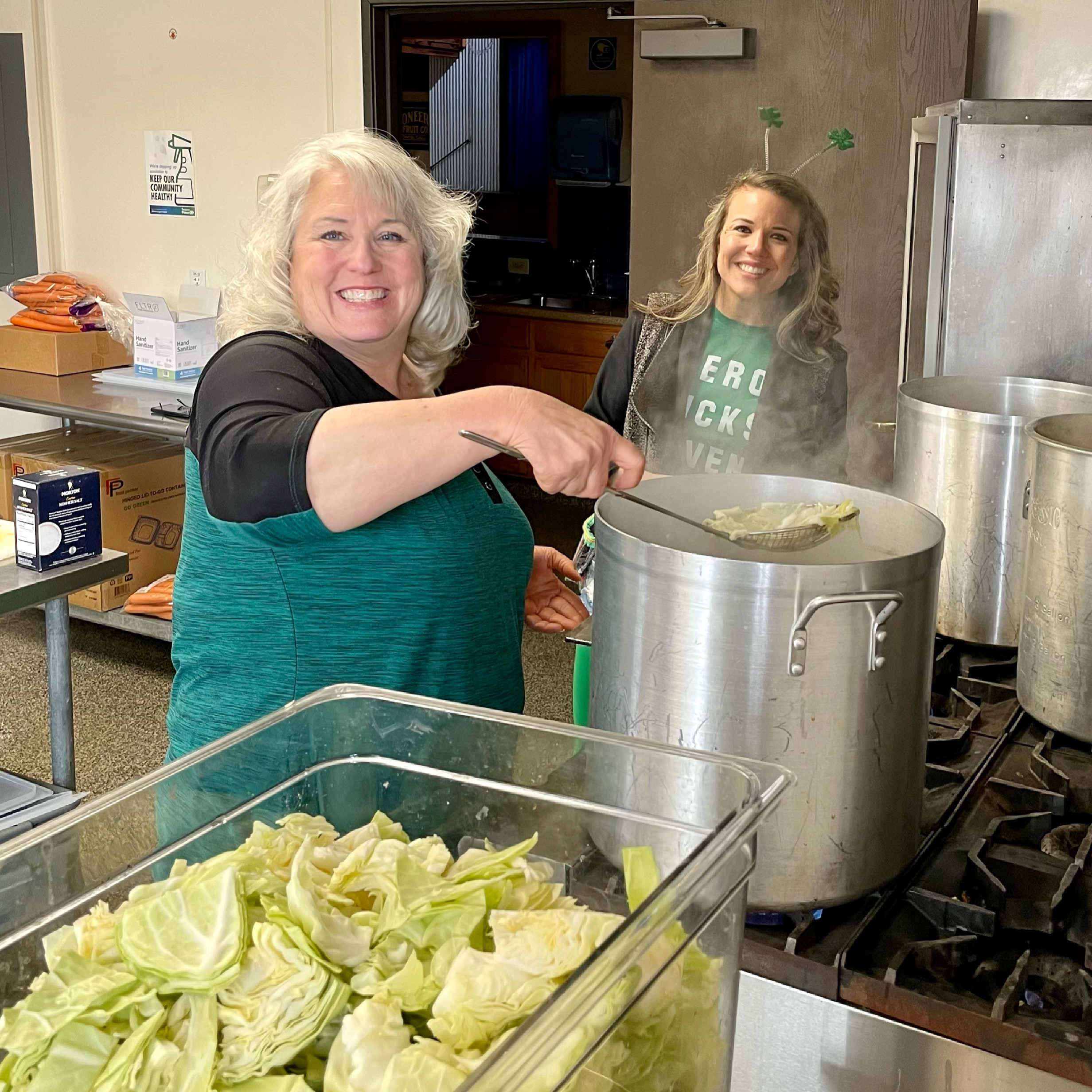 3173 – LtoR Chris Hebard-Summers and Ashley Summers cooking Soroptimist St. Patrick’s Dinner